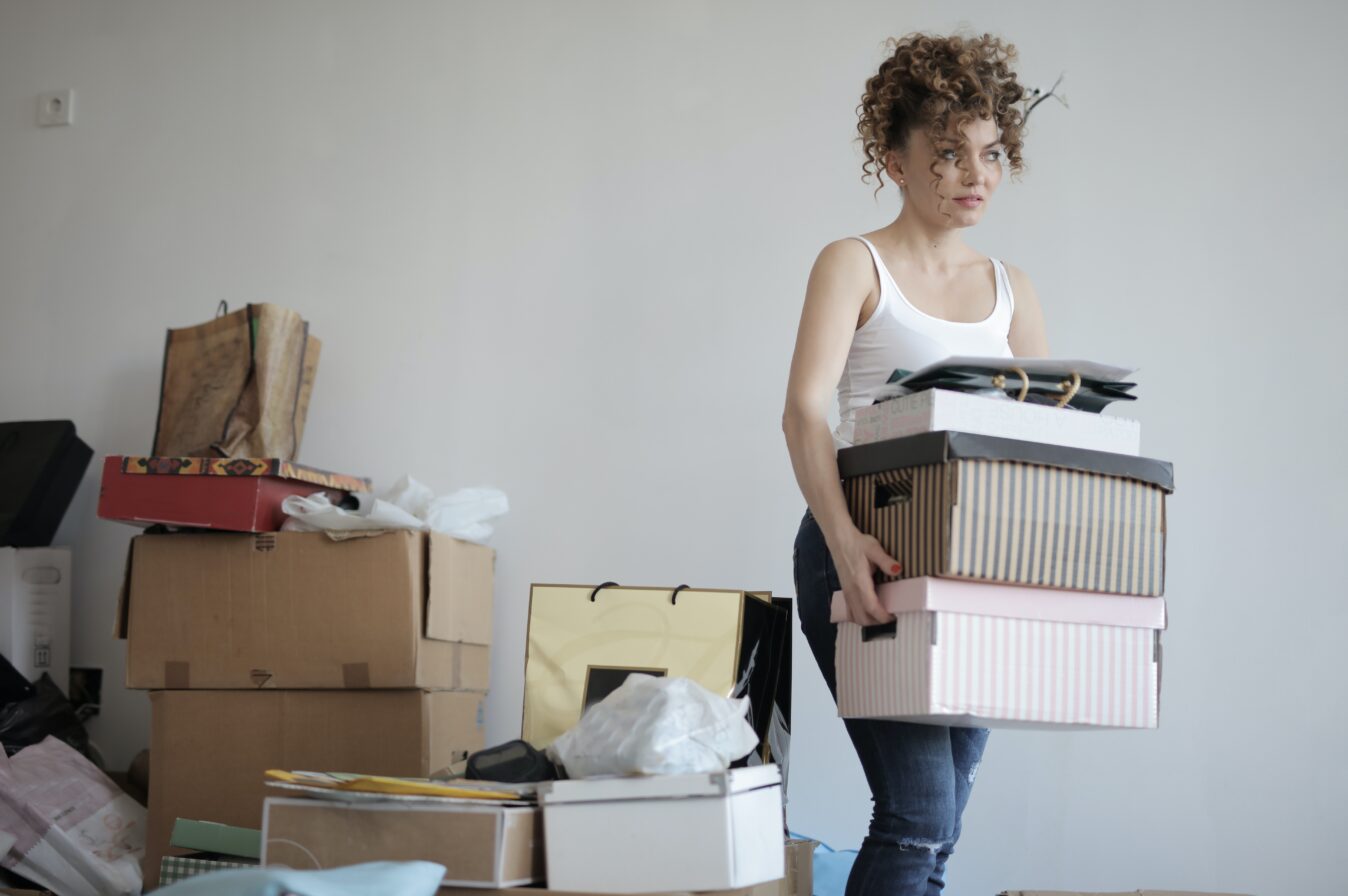 Woman soring through piles of things